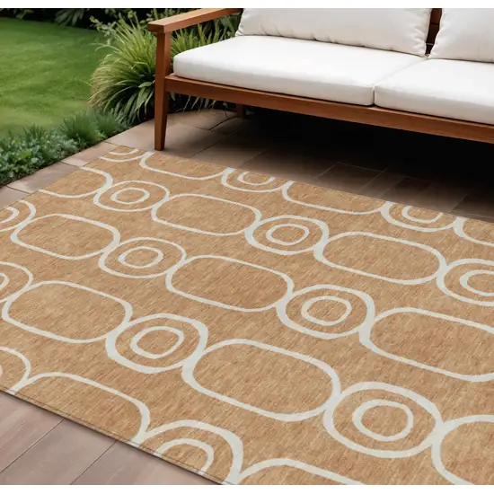 Rust And Ivory Geometric Washable Indoor Outdoor Area Rug Photo 1