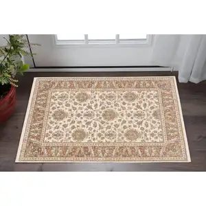 Photo of Rust And Ivory Oriental Power Loom Stain Resistant Area Rug With Fringe