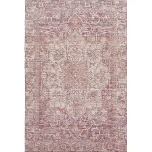 Photo of Rust And Ivory Oriental Washable Area Rug With UV Protection