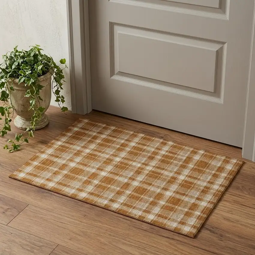 Rust And Ivory Plaid Washable Area Rug With UV Protection Photo 1