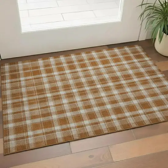 Rust And Ivory Plaid Washable Area Rug With UV Protection Photo 1