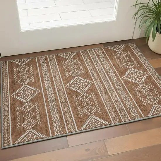 Rust And Ivory Southwestern Washable Area Rug With UV Protection Photo 2