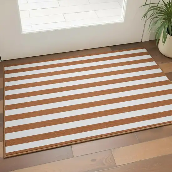 Rust And Ivory Striped Washable Area Rug With UV Protection Photo 2
