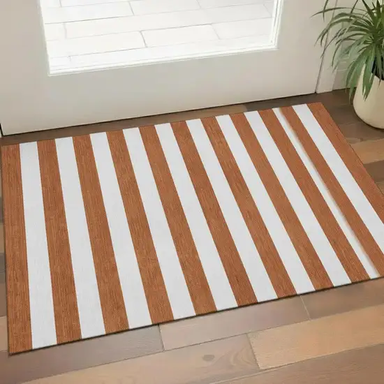 Rust And Ivory Striped Washable Area Rug With UV Protection Photo 1