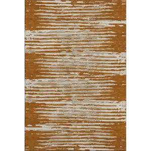 Photo of Rust And Ivory Striped Washable Area Rug With UV Protection