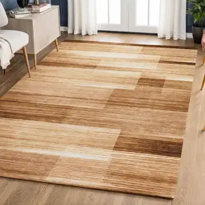 Photo of Rust And Ivory Striped Washable Area Rug With UV Protection