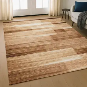 Photo of Rust And Ivory Striped Washable Area Rug With UV Protection