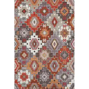 Photo of Rust And Lavender Geometric Washable Area Rug With UV Protection