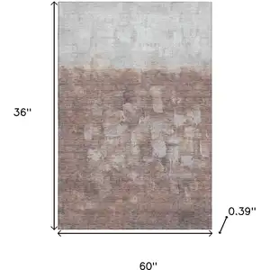 Photo of Rust And Silver Abstract Washable Area Rug With UV Protection
