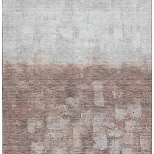 Photo of Rust And Silver Abstract Washable Area Rug With UV Protection