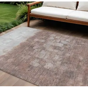 Photo of Rust And Silver Abstract Washable Indoor Outdoor Area Rug