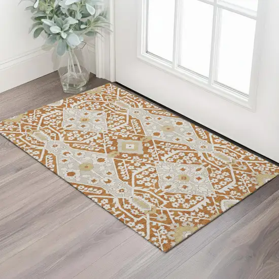 Rust Beige And Gold Floral Washable Area Rug With UV Protection Photo 1
