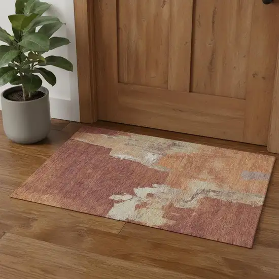 Rust Beige And Peach Abstract Washable Area Rug With UV Protection Photo 1