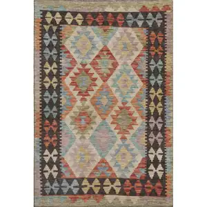Photo of Rust Blue And Beige Tribal Washable Area Rug With UV Protection