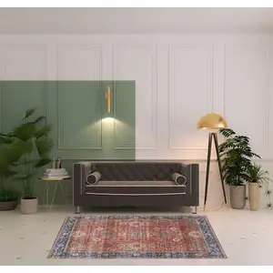 Photo of Rust Blue And White Oriental Distressed Area Rug