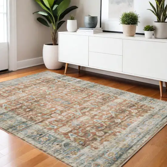 Rust Blue Ivory And Gold Oriental Printed Stain Resistant Non Skid Area Rug Photo 1