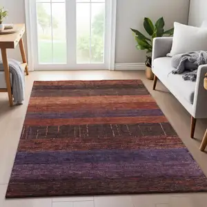 Photo of Rust Eggplant And Terra Cotta Striped Washable Area Rug With UV Protection