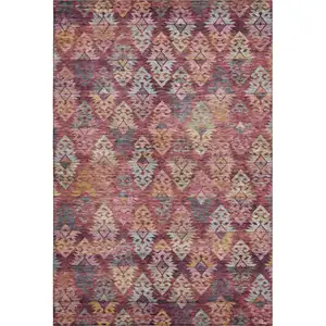 Photo of Rust Gold And Gray Ikat Washable Area Rug With UV Protection