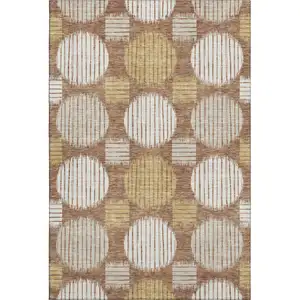 Photo of Rust Gold And Ivory Geometric Washable Area Rug With UV Protection
