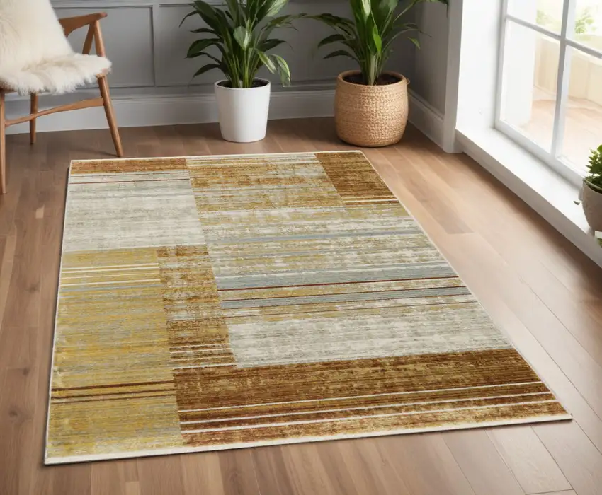 Rust Gold Blue Grey Ivory And Tan Geometric Power Loom Stain Resistant Area Rug With Fringe Photo 1
