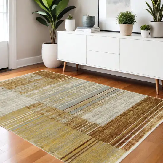 Rust Gold Blue Grey Ivory And Tan Geometric Power Loom Stain Resistant Area Rug With Fringe Photo 1