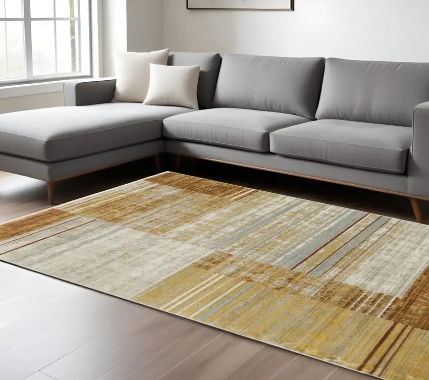 Rust Gold Blue Grey Ivory And Tan Geometric Power Loom Stain Resistant Area Rug With Fringe Photo 1