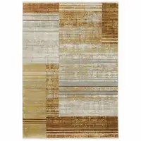 Photo of Rust Gold Blue Grey Ivory And Tan Geometric Power Loom Stain Resistant Area Rug With Fringe