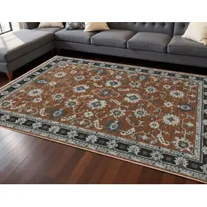Photo of Rust Gray And Beige Oriental Area Rug With Fringe