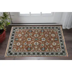 Photo of Rust Gray And Beige Oriental Area Rug With Fringe