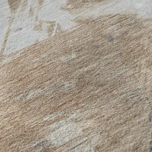 Photo of Rust Gray And Ivory Abstract Washable Area Rug With UV Protection