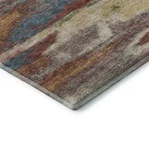 Photo of Rust Green And Gold Abstract Washable Area Rug With UV Protection