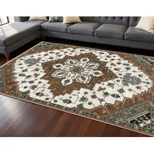 Photo of Rust Ivory And Black Medallion Area Rug With Fringe