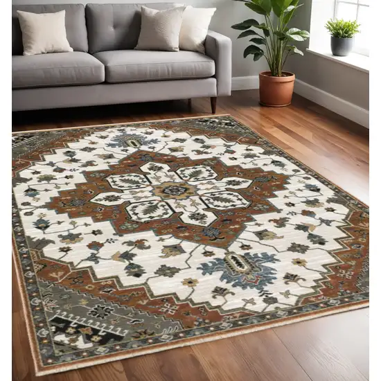 Rust Ivory And Black Medallion Area Rug With Fringe Photo 1
