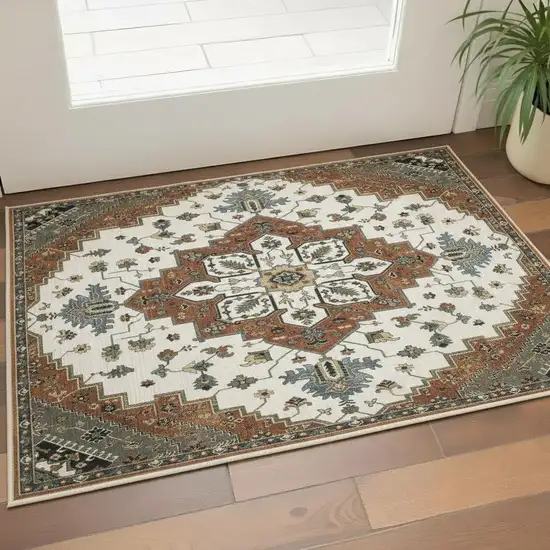 Rust Ivory And Black Medallion Area Rug With Fringe Photo 1