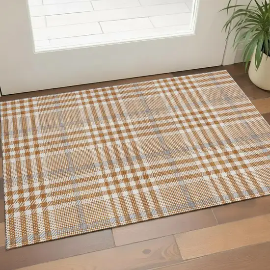 Rust Ivory And Gray Plaid Washable Area Rug With UV Protection Photo 1