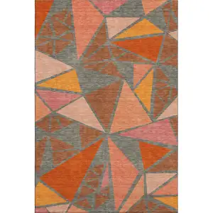 Photo of Rust Orange And Salmon Geometric Washable Area Rug With UV Protection