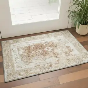 Photo of Rust and Ivory Floral Power Loom Worn Faded Area Rug
