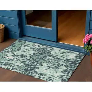 Photo of Sage Black And Ivory Striped Washable Indoor Outdoor Area Rug