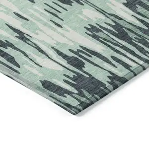 Photo of Sage Black And Ivory Striped Washable Indoor Outdoor Area Rug