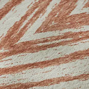 Photo of Salmon And Beige Abstract Washable Area Rug With UV Protection