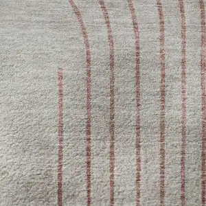 Photo of Salmon And Beige Geometric Washable Area Rug With UV Protection