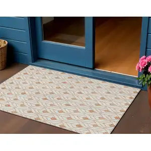 Photo of Salmon And Beige Geometric Washable Indoor Outdoor Area Rug