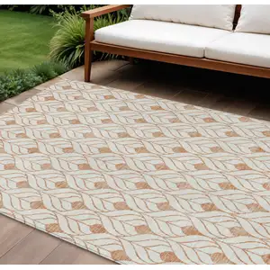 Photo of Salmon And Beige Geometric Washable Indoor Outdoor Area Rug