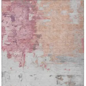 Photo of Salmon And Blush Abstract Washable Indoor Outdoor Area Rug