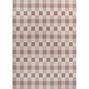 Photo of Salmon And Cream Geometric Indoor Outdoor Area Rug