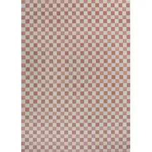 Photo of Salmon And Cream Geometric Indoor Outdoor Area Rug