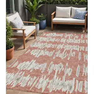 Photo of Salmon And Gray Striped Washable Indoor Outdoor Area Rug