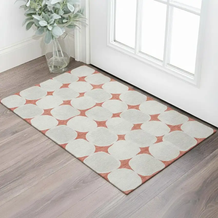 Salmon And Ivory Abstract Geometric Washable Area Rug With UV Protection Photo 1