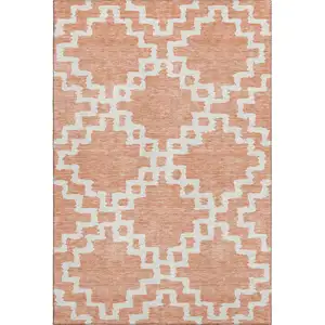 Photo of Salmon And Ivory Abstract Geometric Washable Area Rug With UV Protection