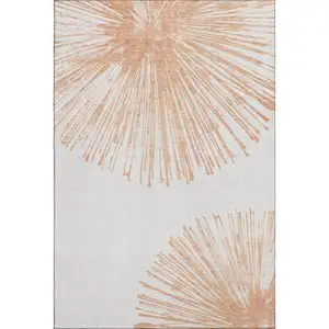 Photo of Salmon And Ivory Abstract Washable Area Rug With UV Protection